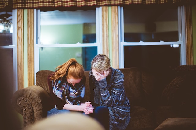 An adult prays for a Christian teen as she helps her build undoubting faith and overcome struggles of doubt.