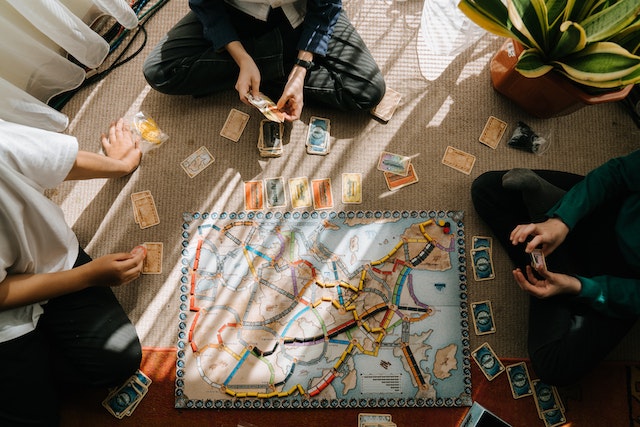 Family members playing one of their favorite Bible board games.