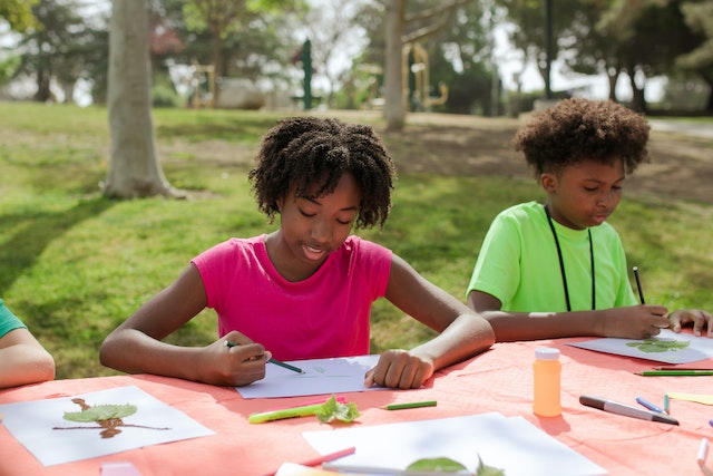 Kids participating in one of the crafts-related Christian camp activities. 