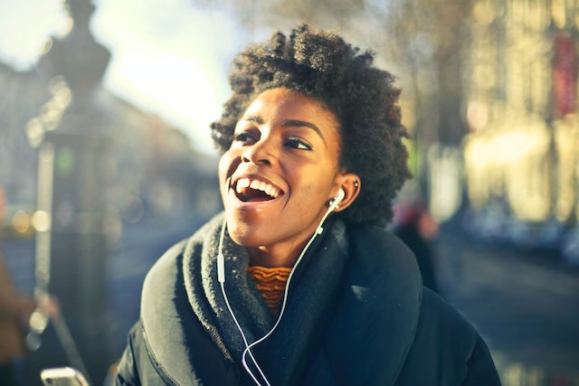 A woman listening to one of the Christian podcasts for women. 
