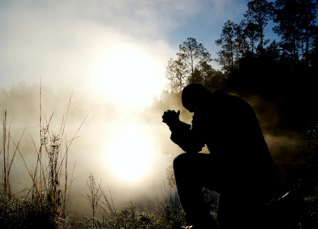 Man praying outdoors