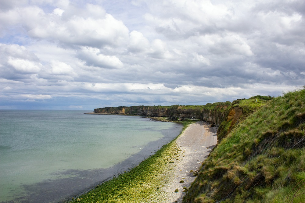 Pointe du Hoc Shoreline, 5/10/2022, photograph by Spencer James Lucas on Unsplash. Free to use under the Unsplash License.