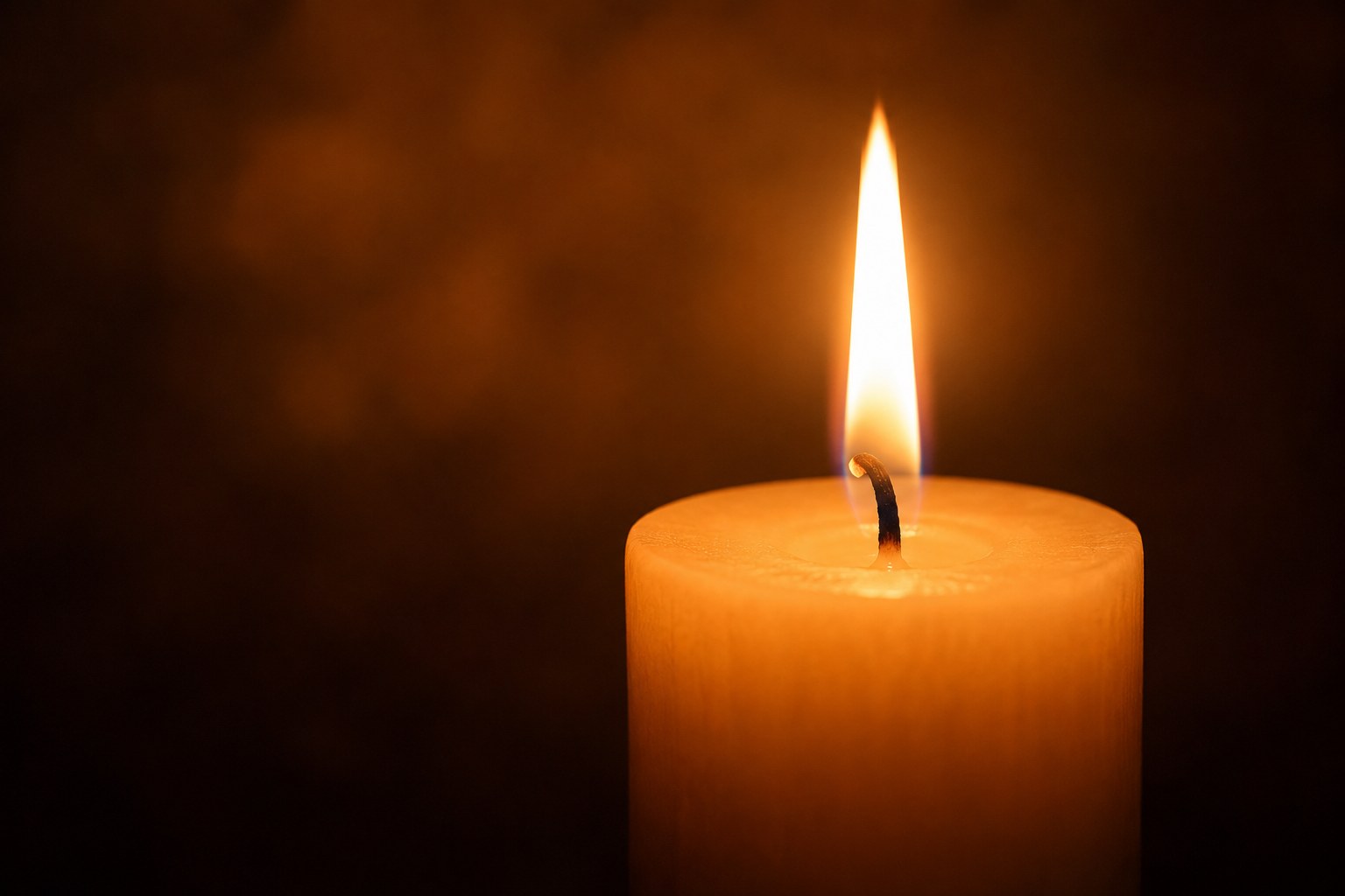 A single steady candle flame, an image of a calmed and steadied mind