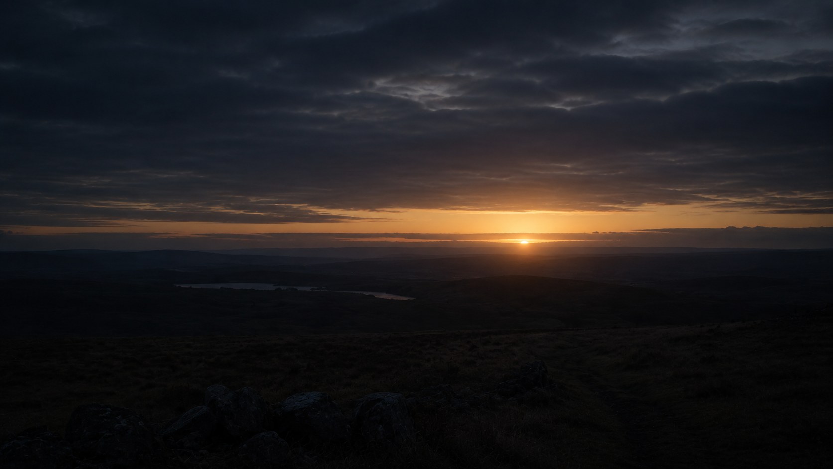 First light breaking over a dark landscape, an image to accompany bible verses for depression