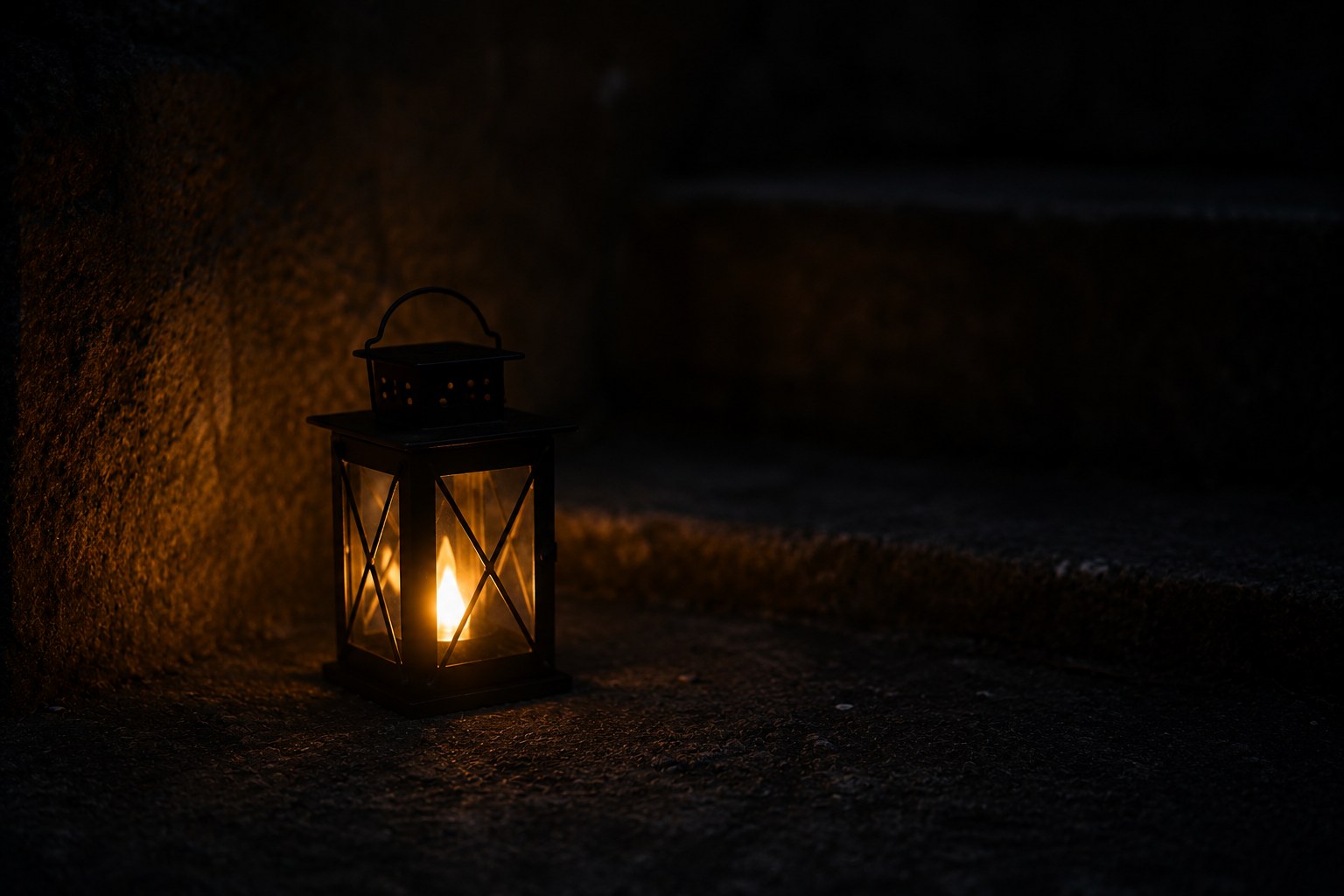 A single small light glowing in darkness, an image of hope in a low season