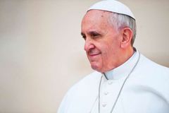 On papal flight, Pope Francis tackles debate over Communion for politicians who support abortion
