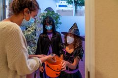 Churches hand out thousands of pounds of candy on Halloween while others decry 'pagan' holiday