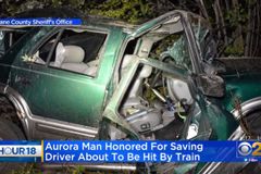 'There's a Train Coming!' Hero Rescues Unconscious Man From Train Tracks Just Seconds Before His Car Is Obliterated