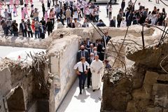French president visits Catholic church in Iraq damaged by ISIS