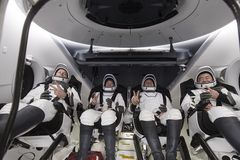 Astronauts return to Earth after 200 days