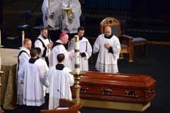 Father Kapaun imitated Christ's love 'throughout his ministry', bishop says at funeral Mass