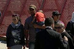 As he leaves Greece, Pope Francis takes 12 refugees with him