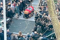 Rome church condemns swastika-draped casket at funeral