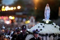 From a dumpster to the head of a procession: The story of 'Broken Mary'