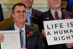 Oklahoma governor signs bill outlawing abortion