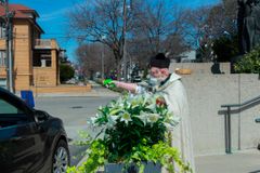 Priest Draws Squirt Gun in Fight Against Coronavirus