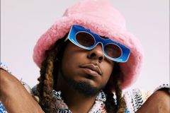 Watch 1K Phew Take Down a Crooked Church Scam in the Music Video for 'The Offering' - RELEVANT