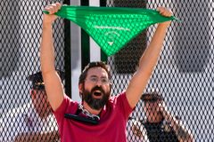 Abortion Rights Activists Wear Bloody Clothing & Carry Dolls While Marching Near Justice Barrett's Home