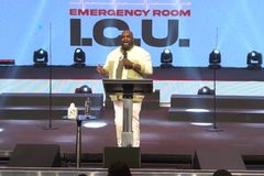 Pastor John Gray praises God as he leaves hospital after health scare