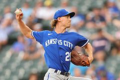 Kansas City Royals pitcher Luke Weaver wears Bible-themed glove on the field