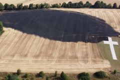 Lenham cross unscathed after field fire scorches ground during heatwave