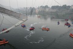 Nine arrested after bridge collapse in India kills 134