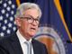 Fed raises interest rates, hints at pullback