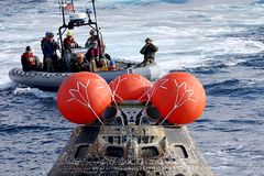 NASA’s Orion capsule splashes down in Pacific