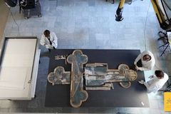 Crushed in an earthquake, shattered 15th-century cross restored in time for Easter