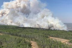 Canadian oil and gas companies pause production as wildfires continue