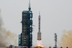 China launches three astronauts to space station