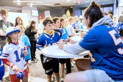 Students-athletes give their lives to Christ at event with Damar Hamlin, Buffalo Bills players