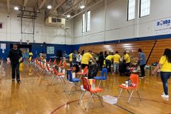 Church distributes over 1,000 pairs of sneakers at back-to-school giveway event