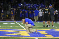 A Football Coach Who Got Job Back After Supreme Court Ruled He Could Pray on the Field Has Resigned