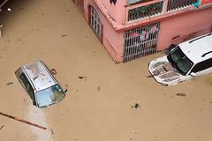 Flash flood in India leaves more than a dozen dead, scores injured