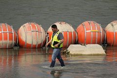 Texas faces off with Biden over floating barrier in Rio Grande