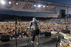 ‘God goes before us’: Over 3,000 attend revival at Arkansas high school football stadium