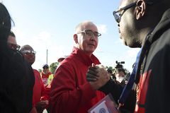 Autoworkers reach tentative deal with Ford; still striking GM, Stellantis