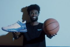 NBA player releases first basketball sneakers with visible Bible verses