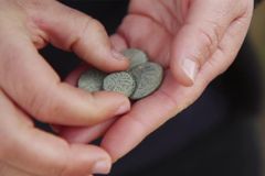 Archeologists discover rare 2nd century coin with Hebrew inscription in Judean Desert