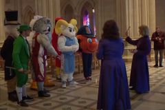 Washington National Cathedral clergy sprinkle holy water on NCAA mascots