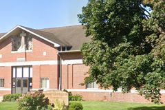 Priest resigns amid backlash over gay author reading to kids at Catholic school