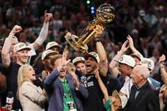 Boston Celtics coach wears shirt thanking God after team wins record-setting NBA title