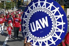 UAW threatens strike against auto giant Stellantis