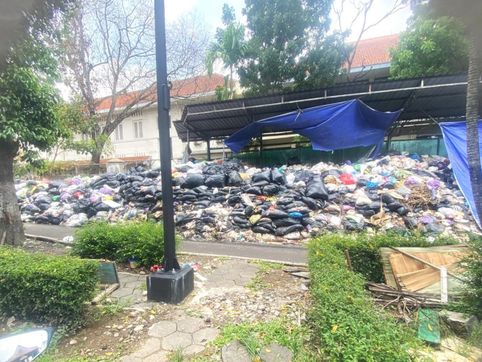 Authorities allow 2 years' worth of uncollected garbage to pile up near church