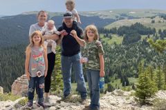 Mother shoots self, 4 daughters in head; father asks world to pray for lone survivor