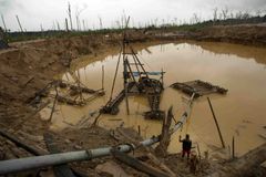 Peru bans mining in north after gangs kill 13 workers