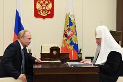 Russian patriarch praises Putin's influence on church-state relations despite persecution concerns