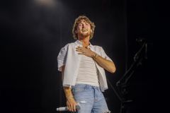 Country Star Bailey Zimmerman Shares Powerful Testimony at Sand in My Boots Festival - RELEVANT