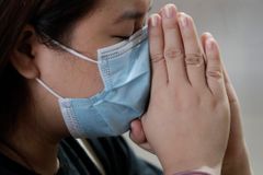 No Handshakes: Viral Outbreak Spooks Asian Places of Worship